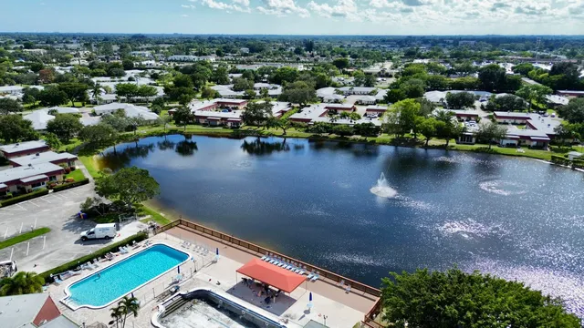 an aerial view of a house with a lake view