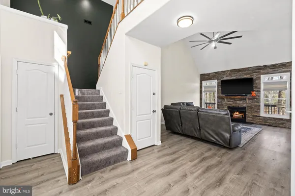 a view of front door with hallway and stairs