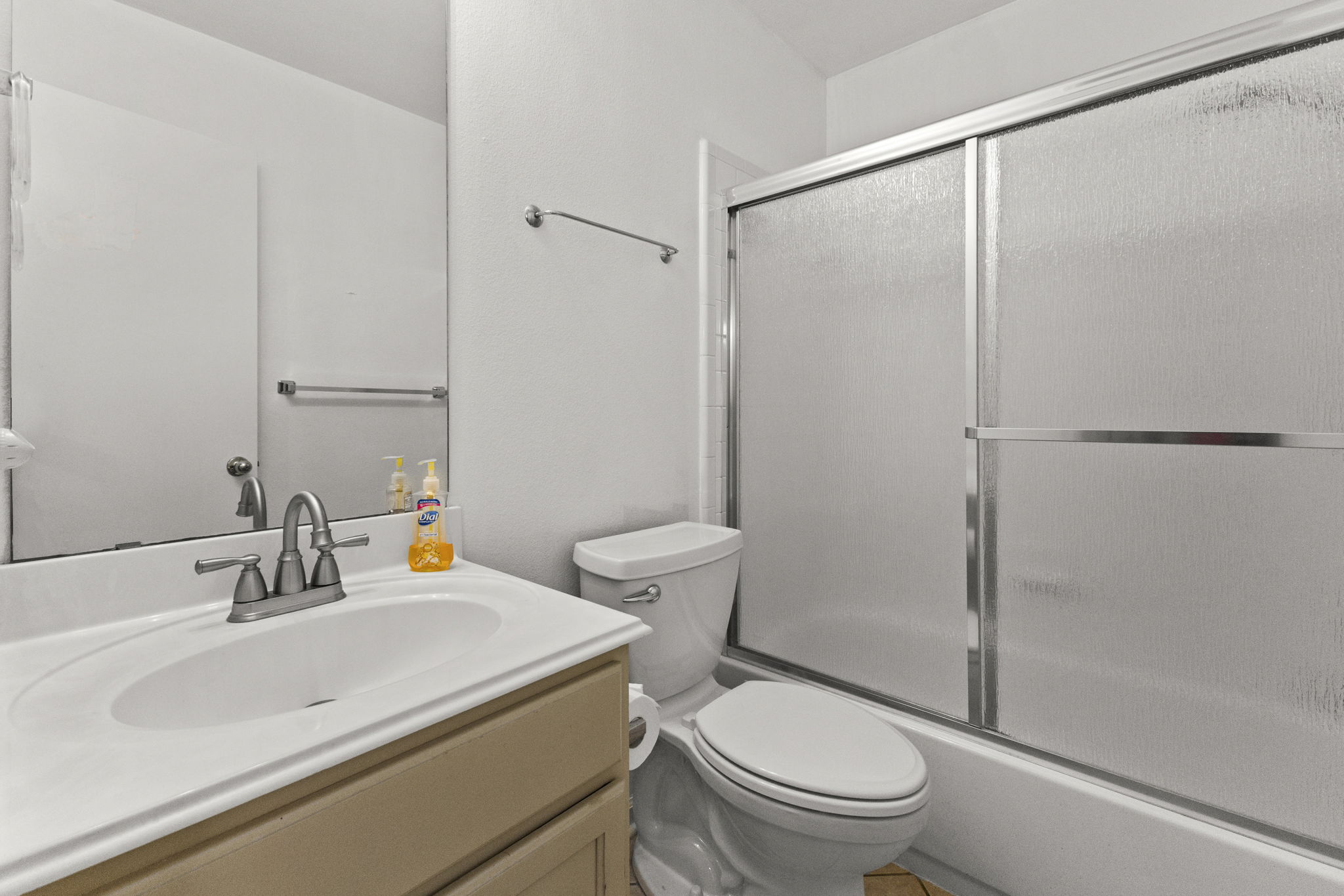290 Bailey Loop Kyle, TX 78640 - Photo 26 of 33 Bathroom featuring a white vanity with an integrated sink, brushed nickel faucet, and a large wall mirror