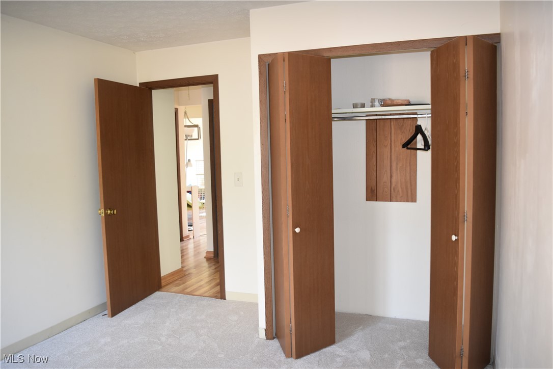 3257 Mayfield Road Cleveland, OH 44118 - Photo 9 of 20 Unfurnished bedroom with a closet and light colored carpet