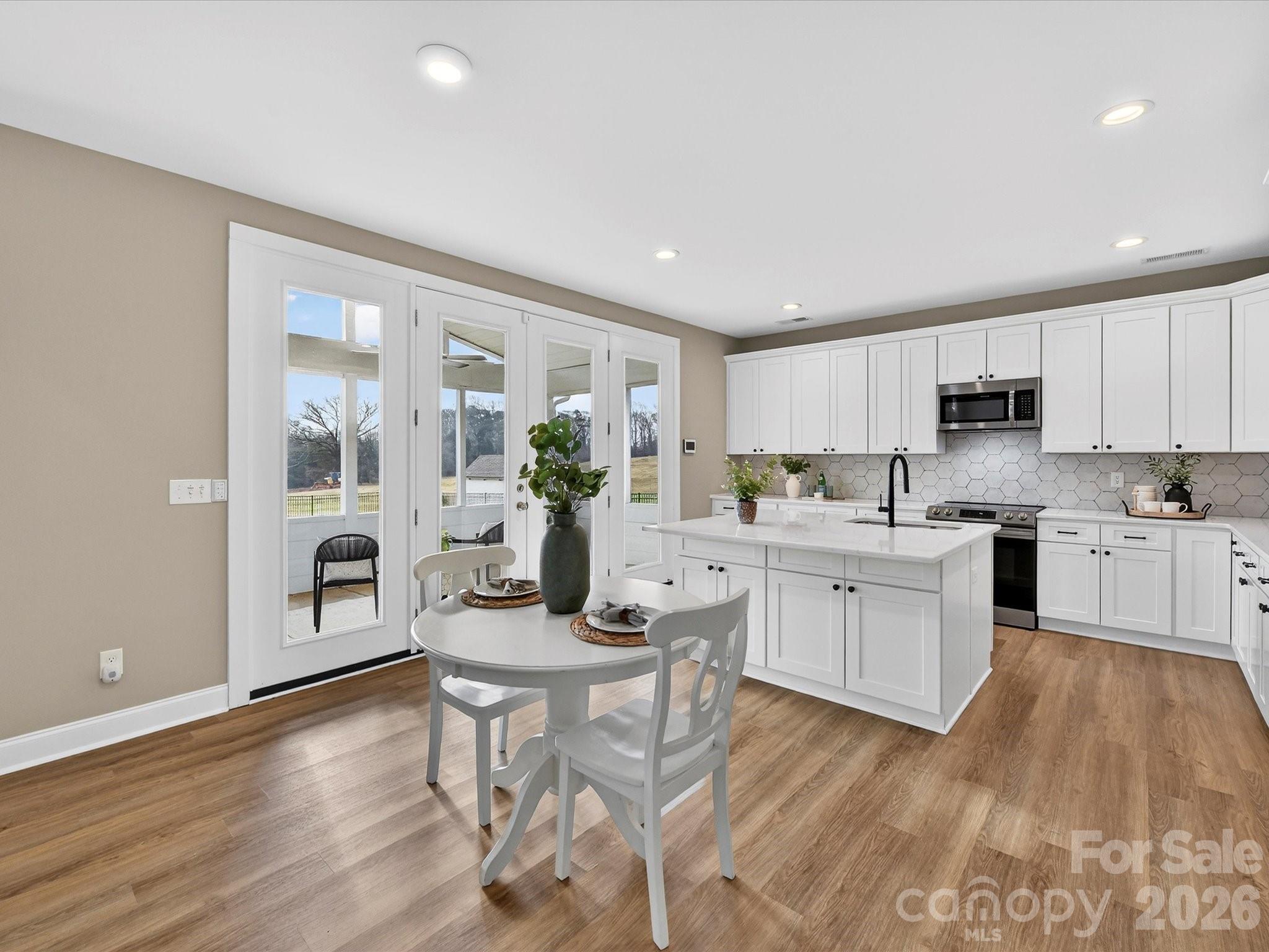 215 Lone Pine Road Statesville, NC 28625 - Photo 12 of 30 a kitchen with white cabinets and counter space