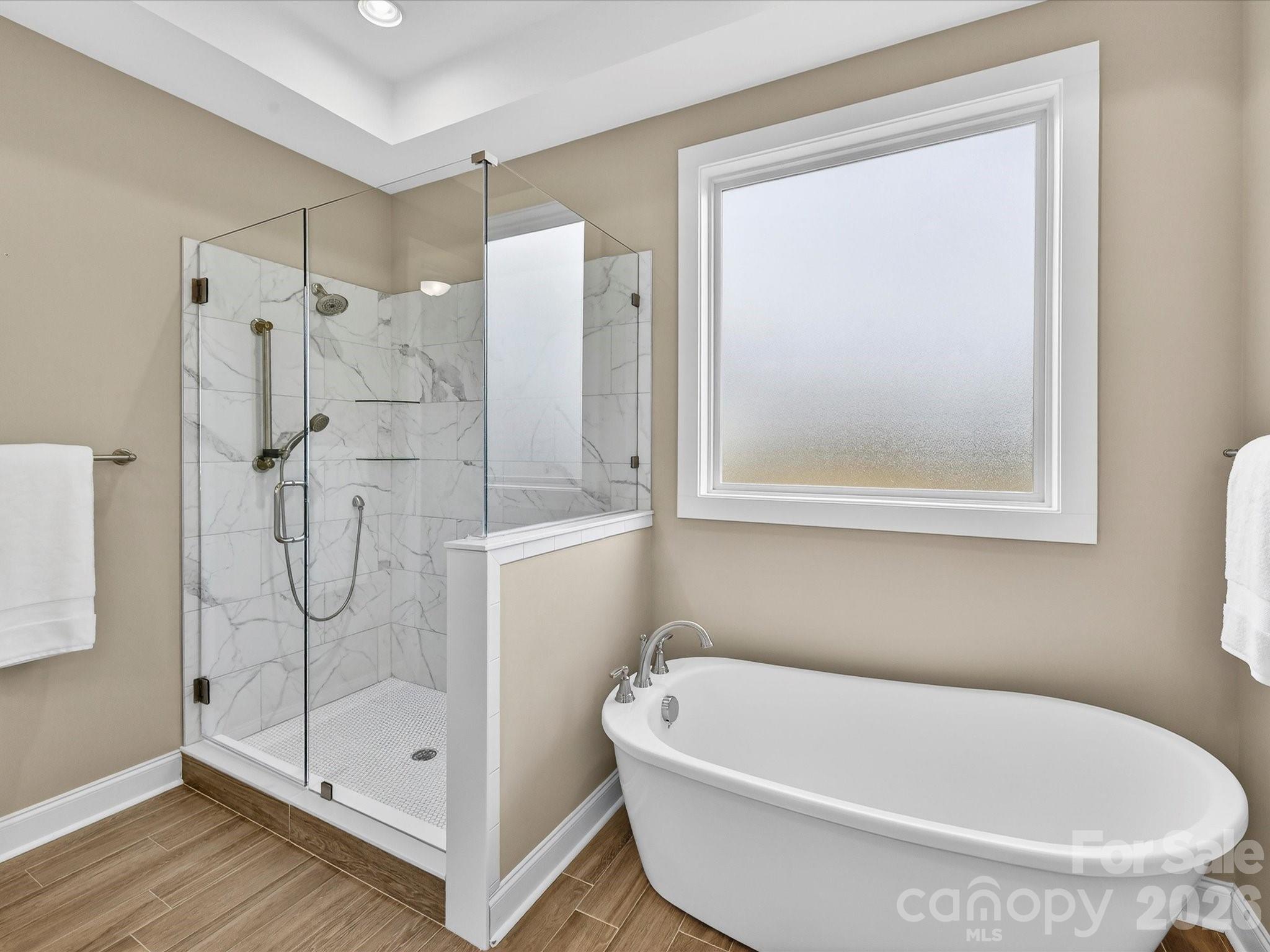 215 Lone Pine Road Statesville, NC 28625 - Photo 16 of 30 a bathroom with a tub and a shower