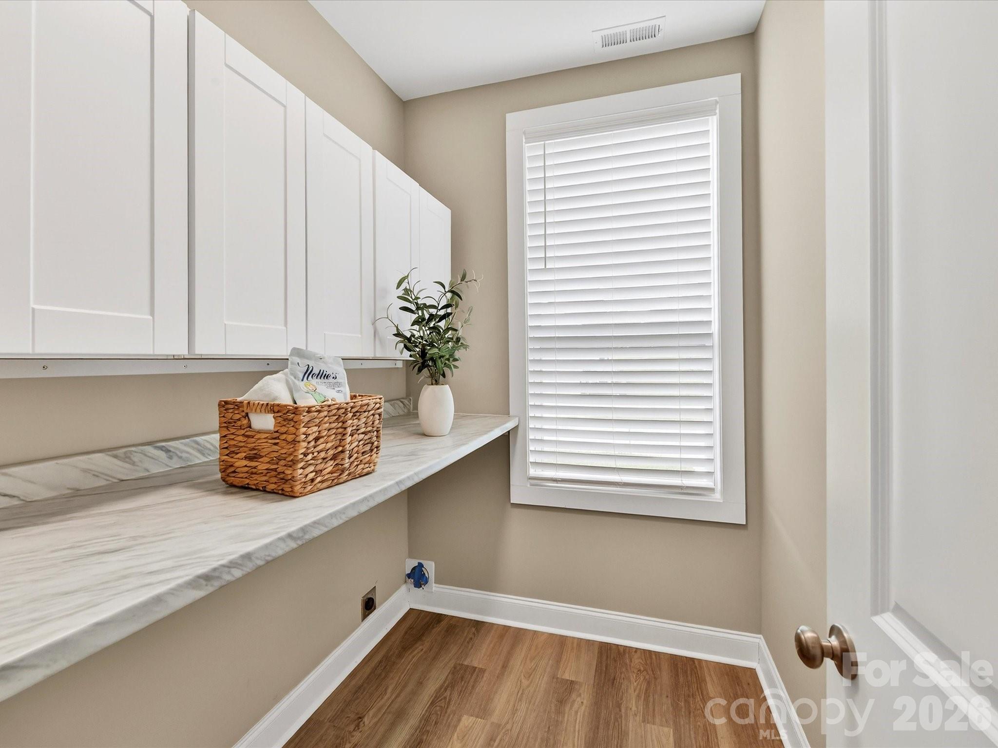 215 Lone Pine Road Statesville, NC 28625 - Photo 20 of 30 a bathroom with a granite countertop sink and a window