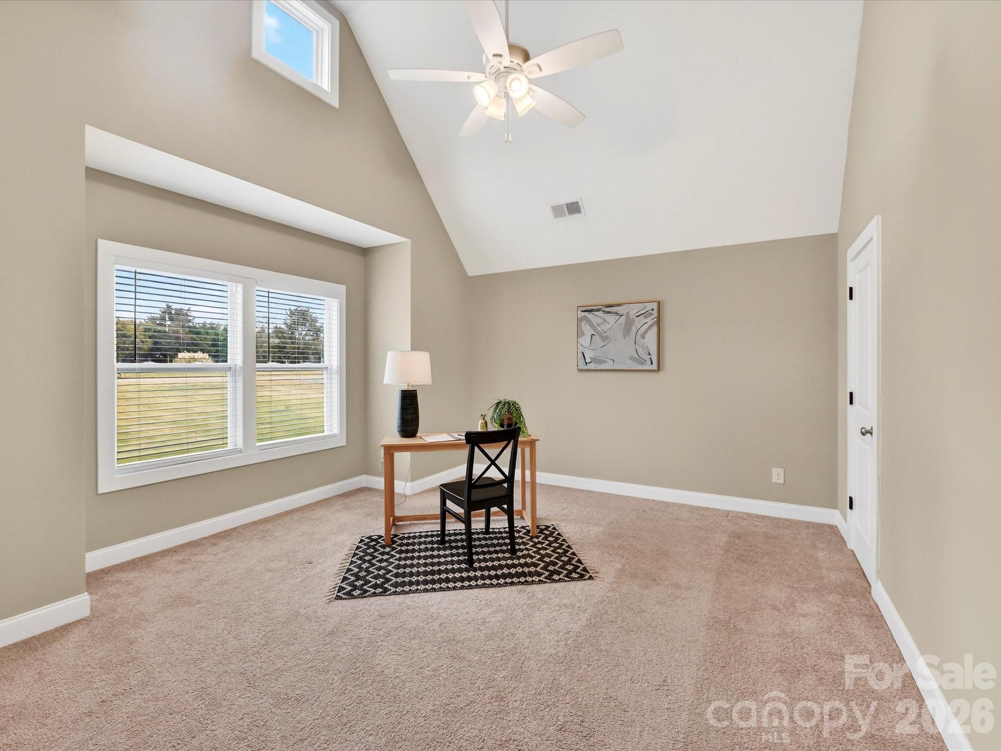215 Lone Pine Road Statesville, NC 28625 - Photo 24 of 30 a dining room with wooden floor and a chandelier