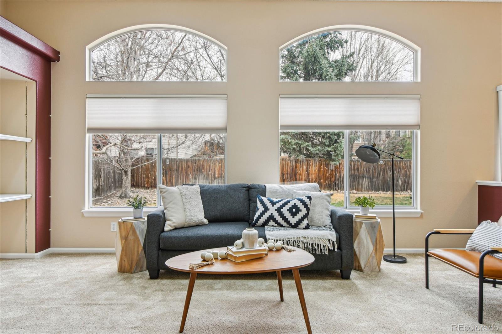 9722 Kipling Street Westminster, CO 80021 - Photo 11 of 45 a living room with furniture and a large window