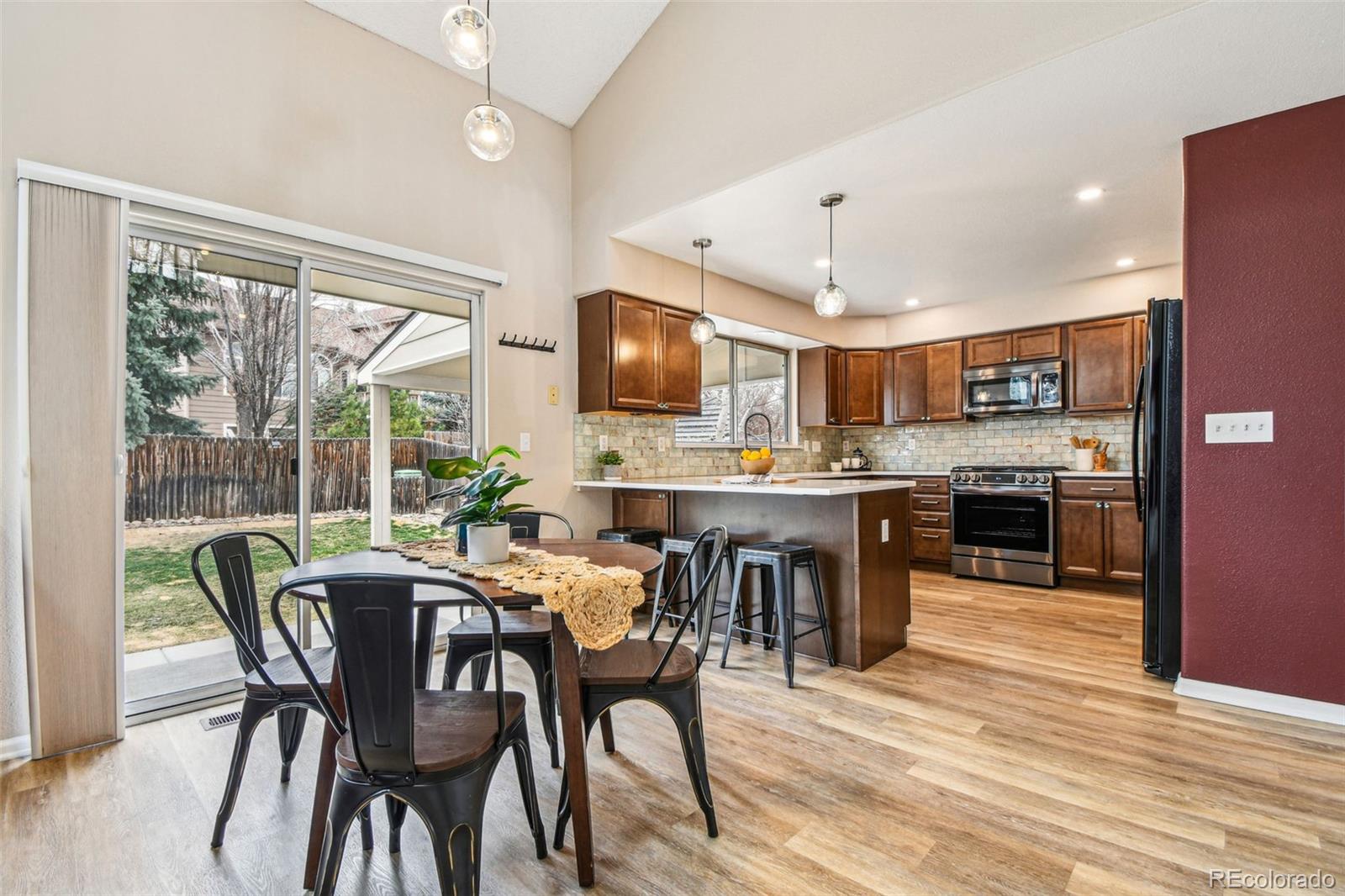 9722 Kipling Street Westminster, CO 80021 - Photo 13 of 45 a view of a dining room with furniture window and outside view