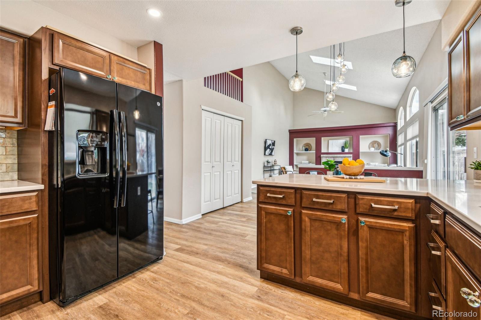 9722 Kipling Street Westminster, CO 80021 - Photo 17 of 45 a kitchen with stainless steel appliances granite countertop a refrigerator and a sink