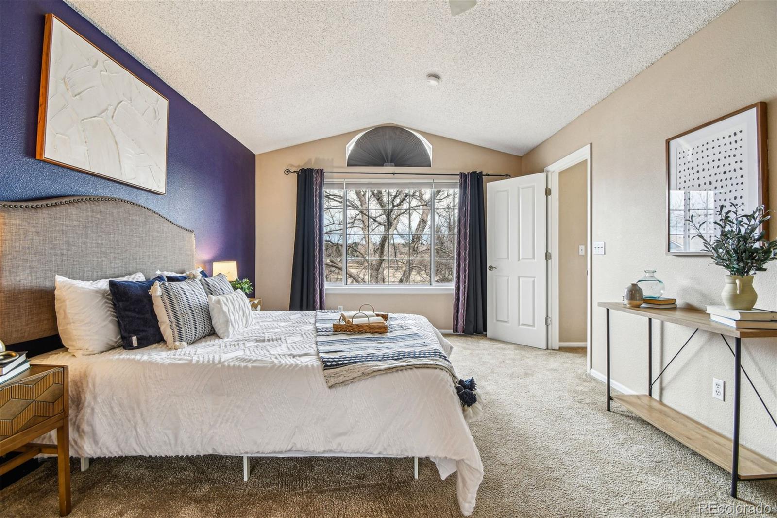 9722 Kipling Street Westminster, CO 80021 - Photo 20 of 45 a bedroom with a bed and window