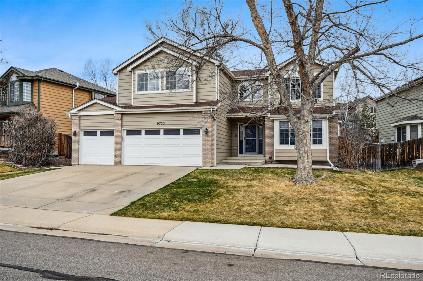 9722 Kipling Street Westminster, CO 80021 - Photo 2 of 45 front view of a house with a yard