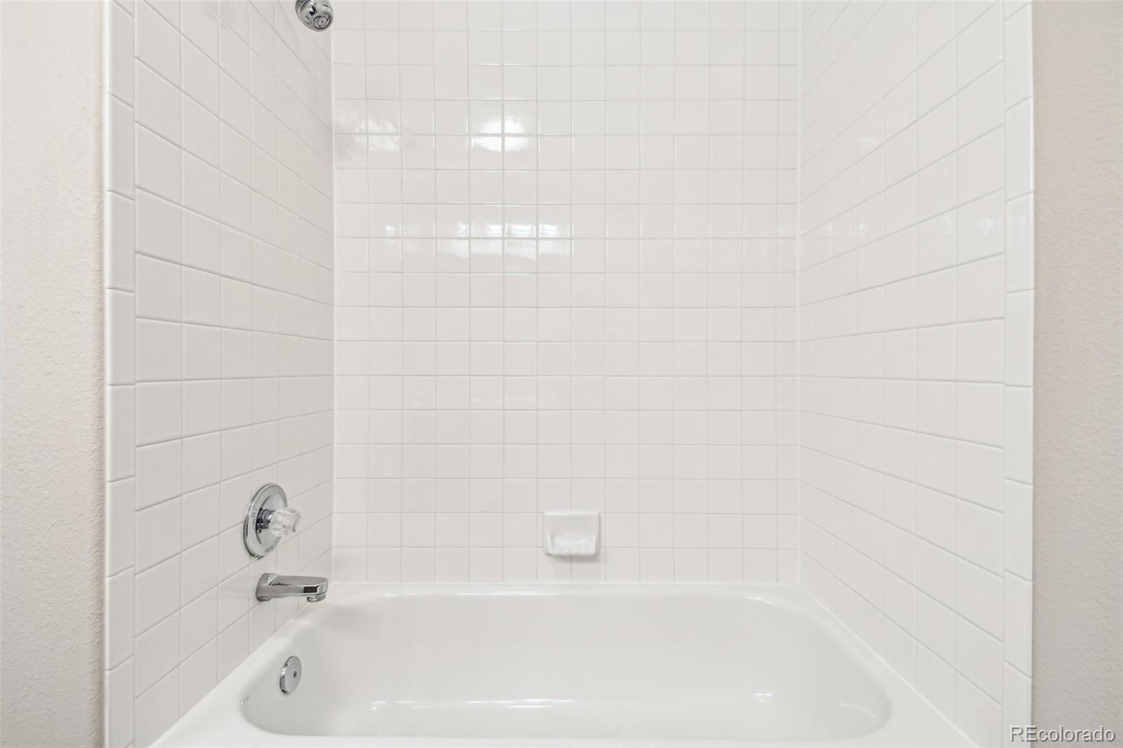 9722 Kipling Street Westminster, CO 80021 - Photo 31 of 45 a bathroom with a bathtub