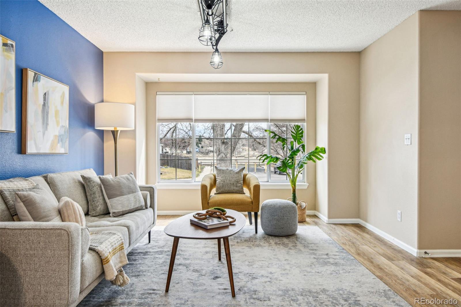 9722 Kipling Street Westminster, CO 80021 - Photo 4 of 45 a living room with furniture and a window