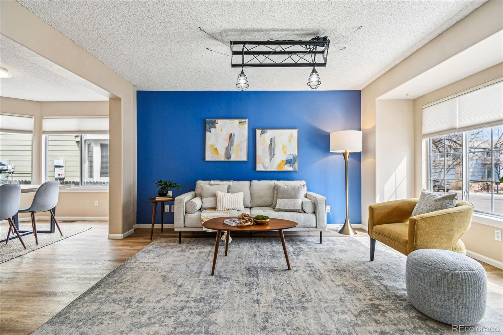 9722 Kipling Street Westminster, CO 80021 - Photo 5 of 45 a living room with furniture and a rug