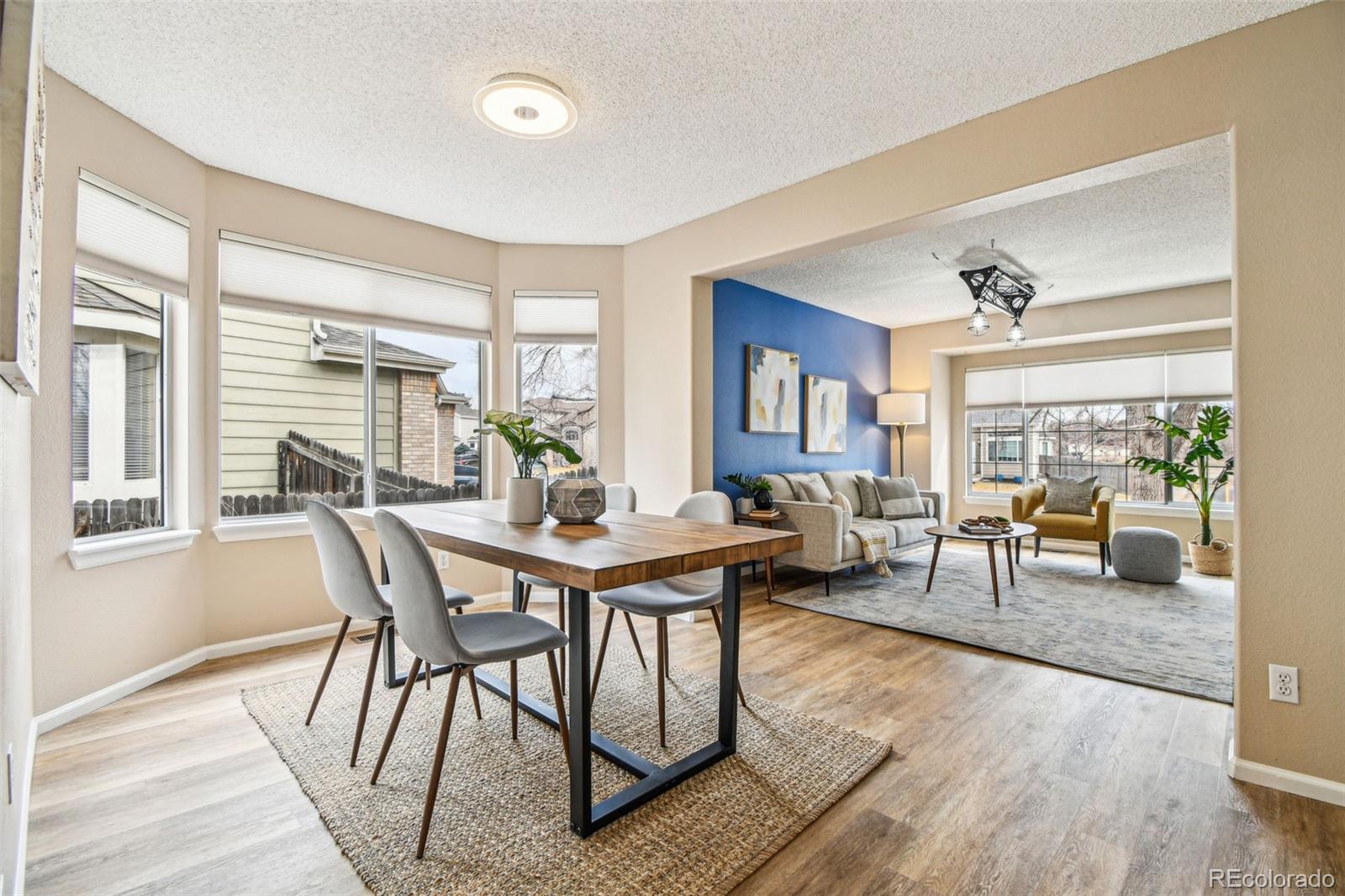 9722 Kipling Street Westminster, CO 80021 - Photo 8 of 45 a view of a dining room with furniture window and wooden floor