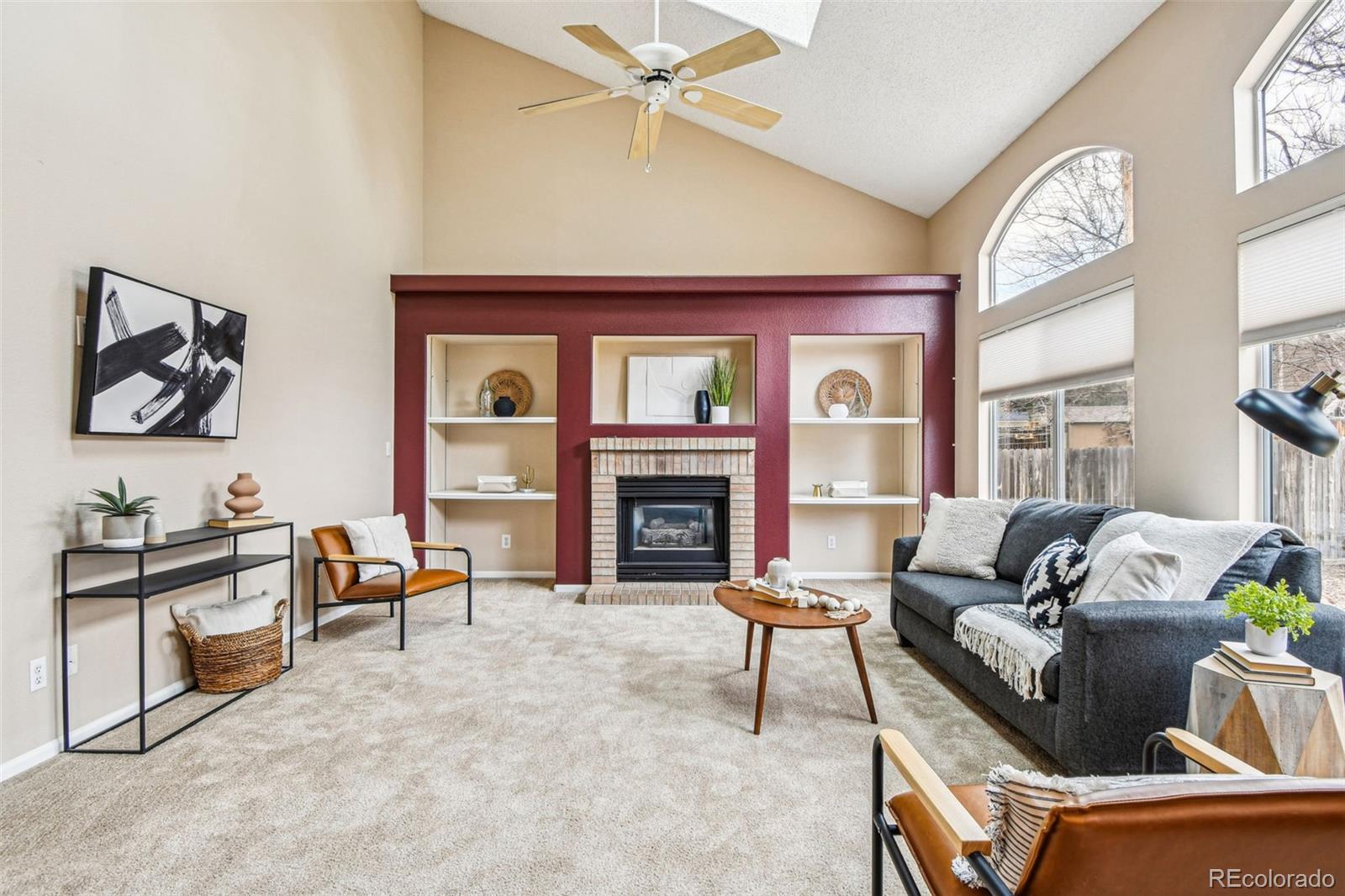 9722 Kipling Street Westminster, CO 80021 - Photo 10 of 45 a living room with furniture and a fireplace