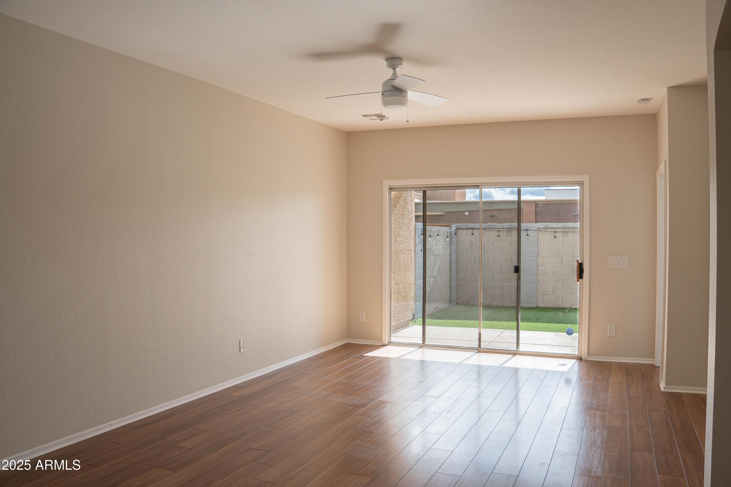 625 North Hamilton Street, Unit 27 Chandler, AZ 85225 - Photo 11 of 40 wooden floor in an empty room with a window