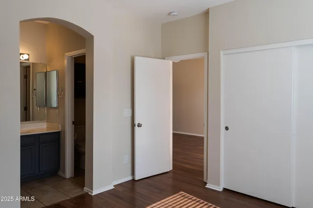 a view of hallway with wooden floor