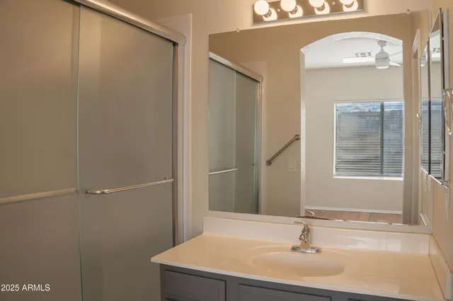 a bathroom with a sink and a mirror