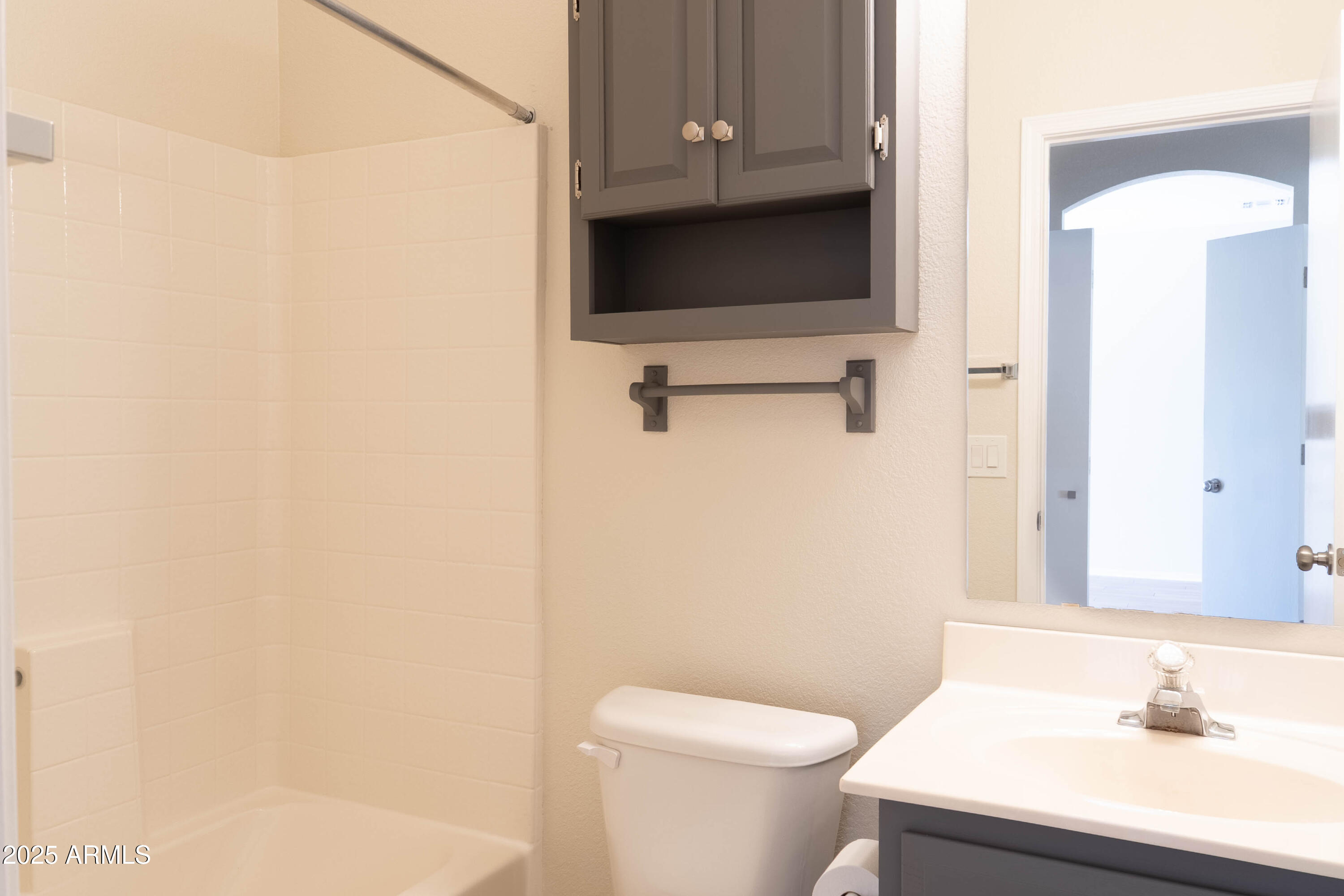 625 North Hamilton Street, Unit 27 Chandler, AZ 85225 - Photo 24 of 40 a bathroom with a sink a toilet and a mirror