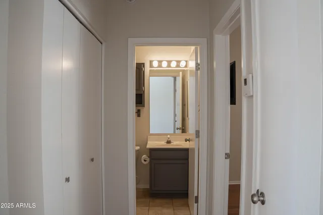 a en suite bathroom with a sink and mirror