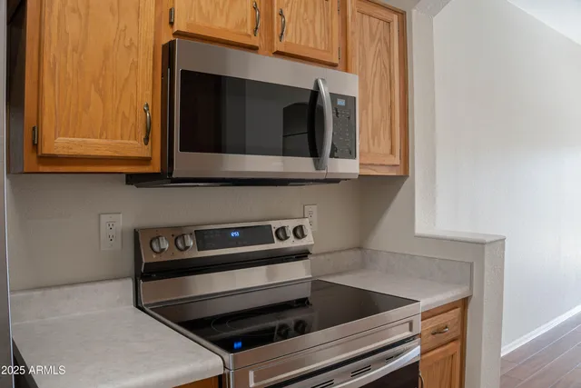 a kitchen with a stove and a microwave