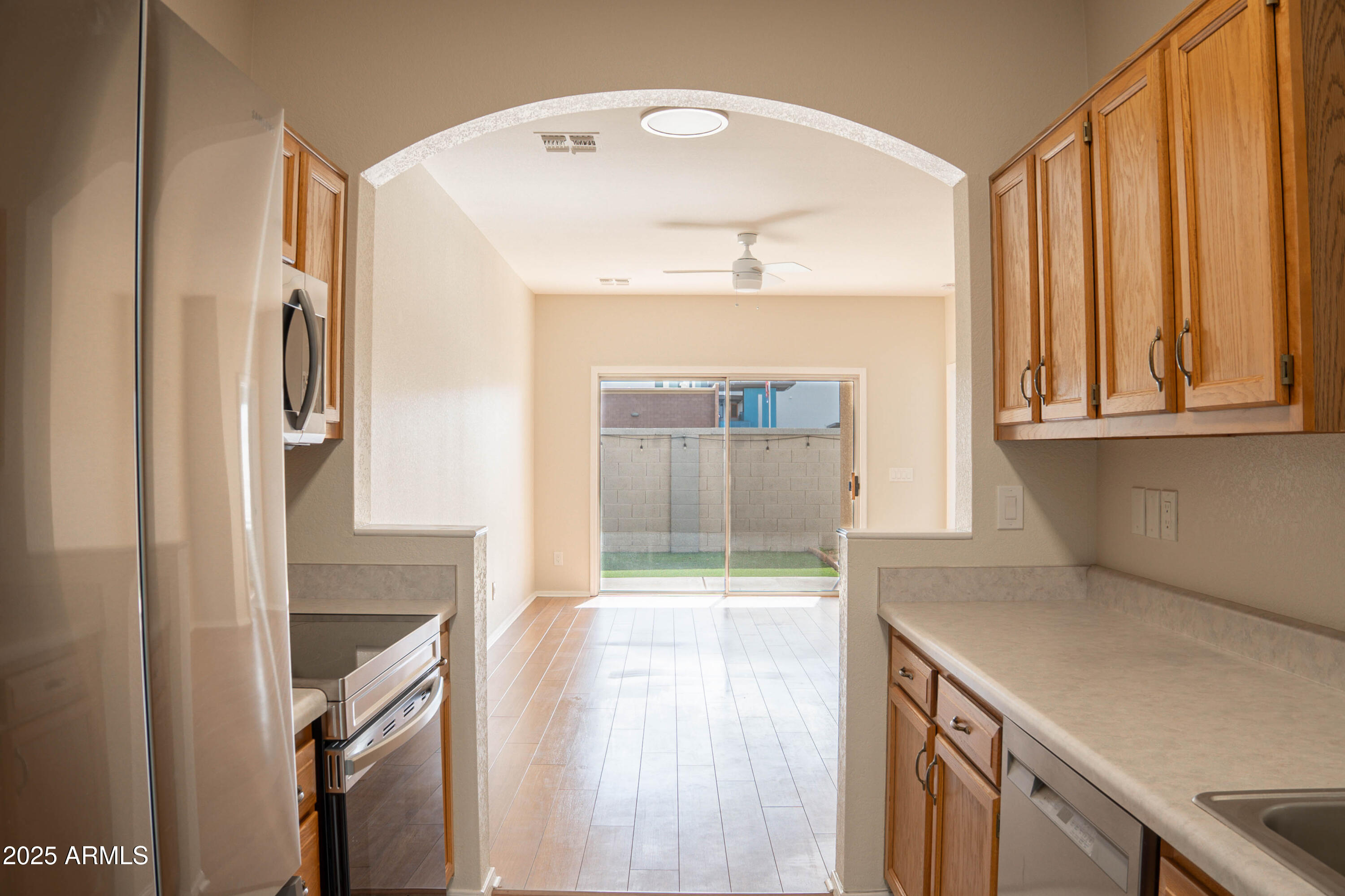 625 North Hamilton Street, Unit 27 Chandler, AZ 85225 - Photo 31 of 40 a kitchen with a refrigerator and window