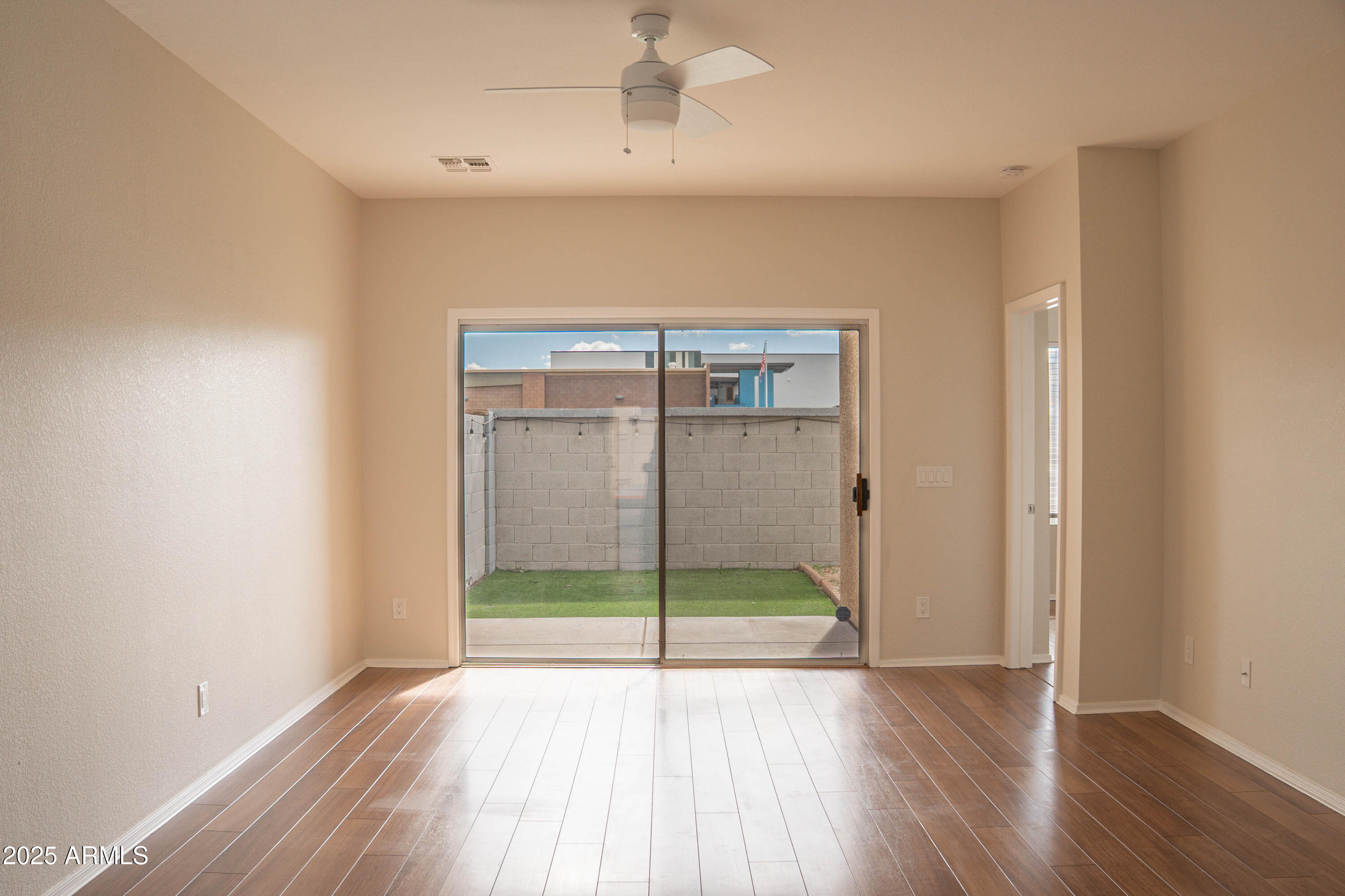625 North Hamilton Street, Unit 27 Chandler, AZ 85225 - Photo 40 of 40 a view of an empty room with wooden floor and a window