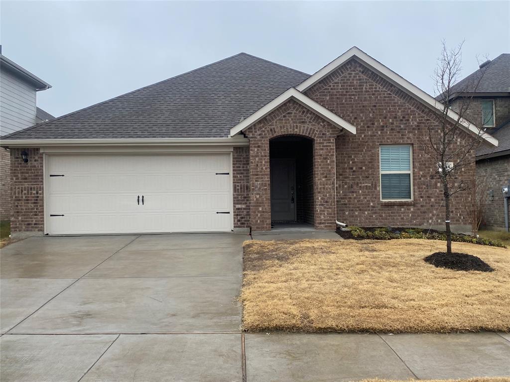 2116 Camellia Street Princeton, TX 75407 - Photo 1 of 5 View of front of home with brick siding, an attached garage, roof with shingles, and concrete driveway