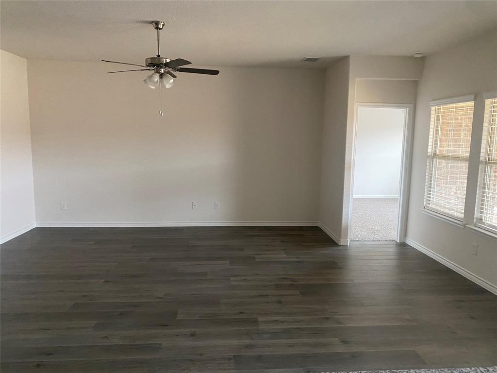 2116 Camellia Street Princeton, TX 75407 - Photo 4 of 5 Spare room featuring dark wood-type flooring and a ceiling fan