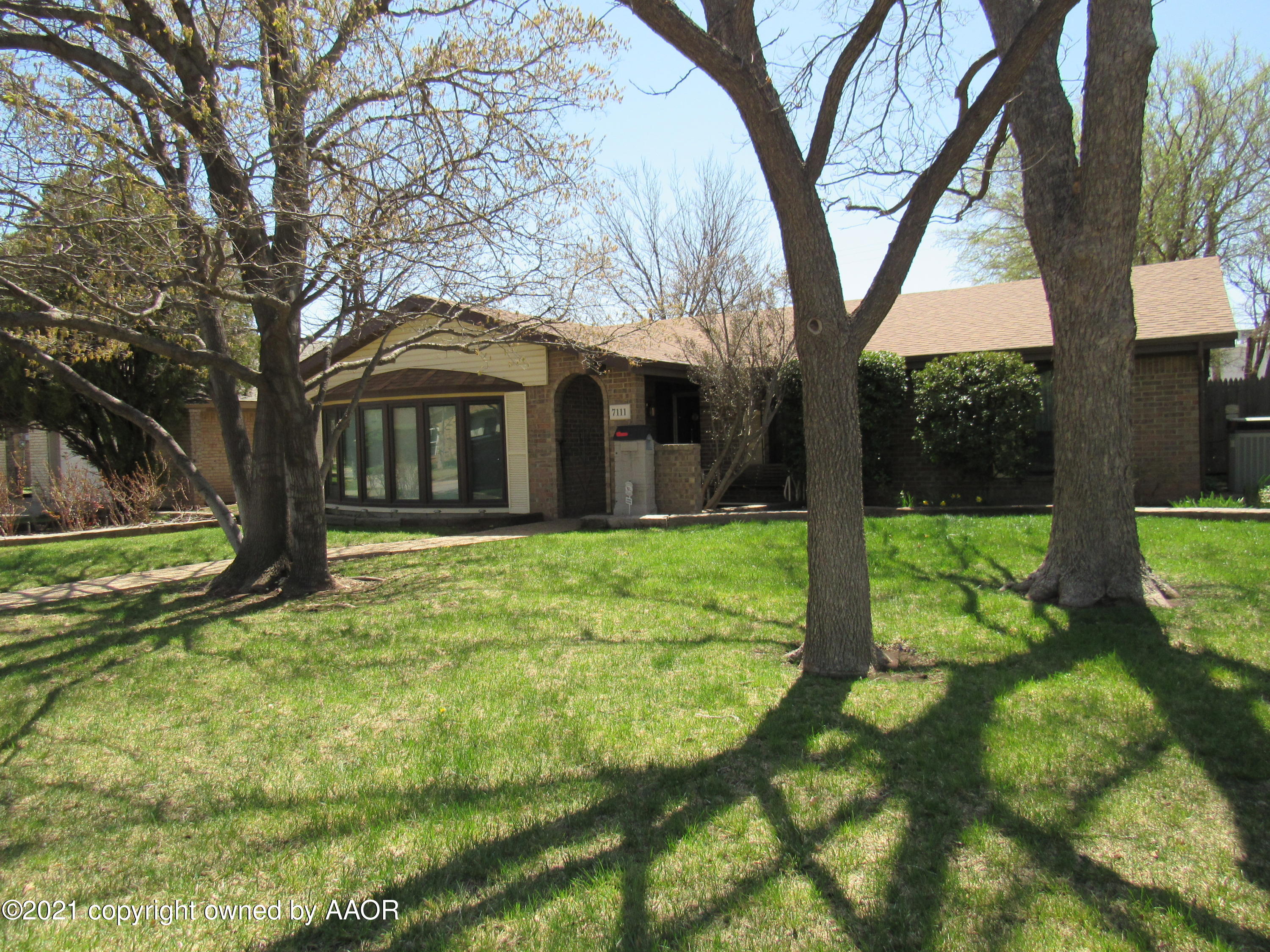 7111 Imperial Trail Amarillo, TX 79106 - Photo 2 of 4 a view of a house with backyard and tree