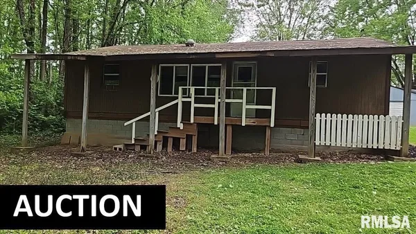 a view of front door and yard