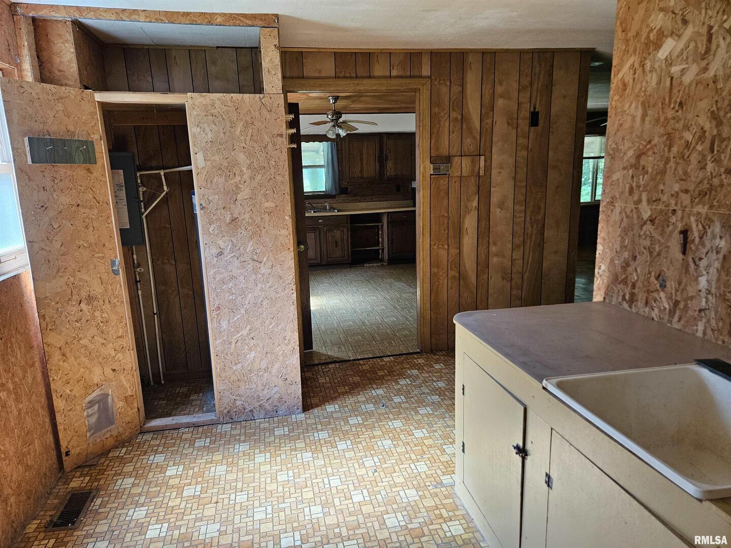 1233 West Harrison Road Murphysboro, IL 62966 - Photo 15 of 24 a kitchen with a refrigerator and a sink