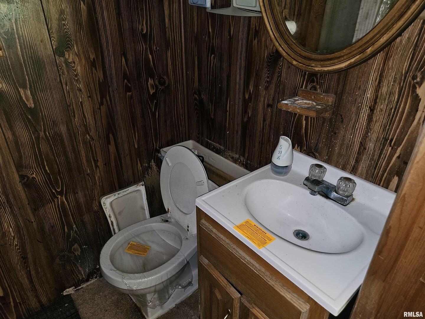 1233 West Harrison Road Murphysboro, IL 62966 - Photo 22 of 24 a bathroom with a sink and a mirror