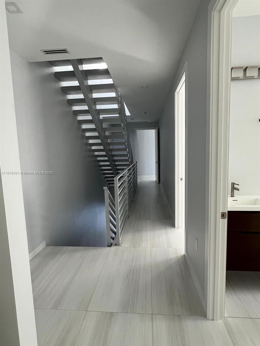 1531 Southwest 22nd Terrace Miami, FL 33145 - Photo 18 of 29 a view of an empty room with stairs