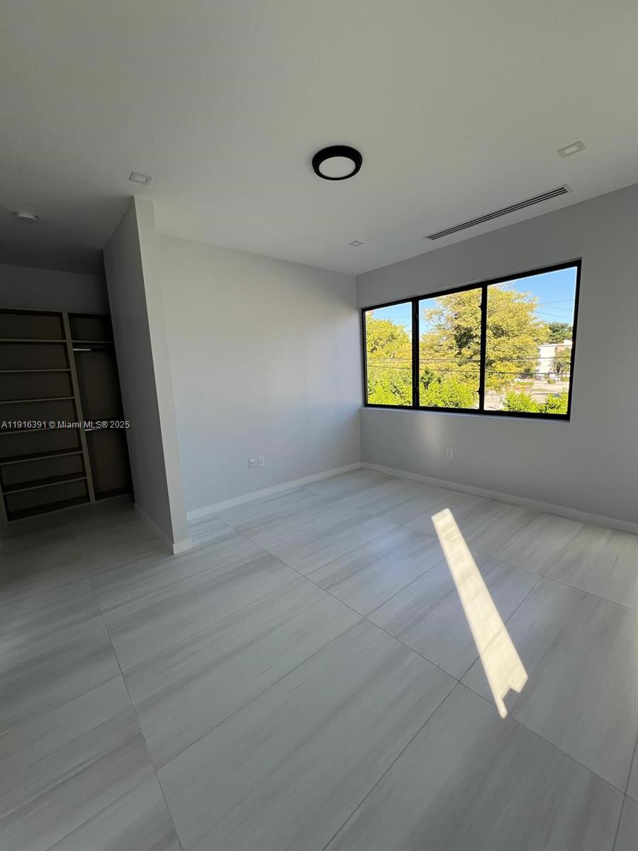 1531 Southwest 22nd Terrace Miami, FL 33145 - Photo 21 of 29 an empty room with windows