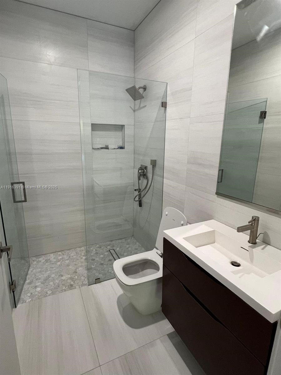 1531 Southwest 22nd Terrace Miami, FL 33145 - Photo 6 of 29 a bathroom with a sink toilet and shower