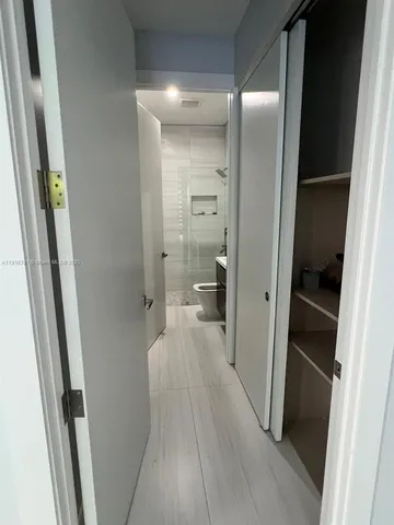 a view of a bathroom from a hallway