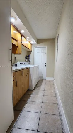 a view of a kitchen with a sink