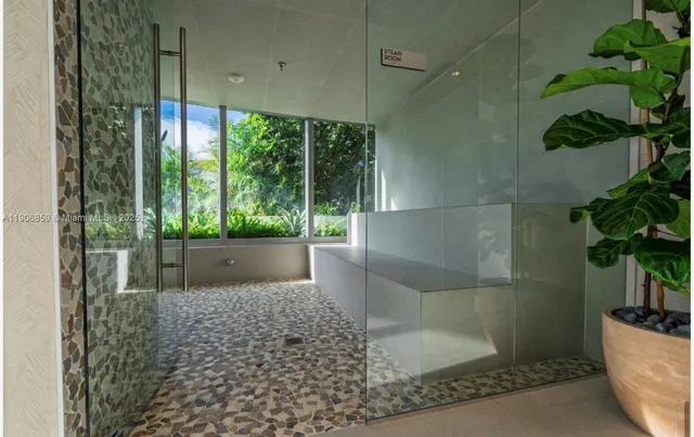 a bathroom with a bathtub and shower