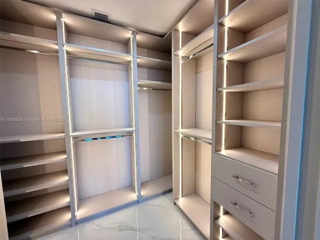 a view of an empty walk in closet