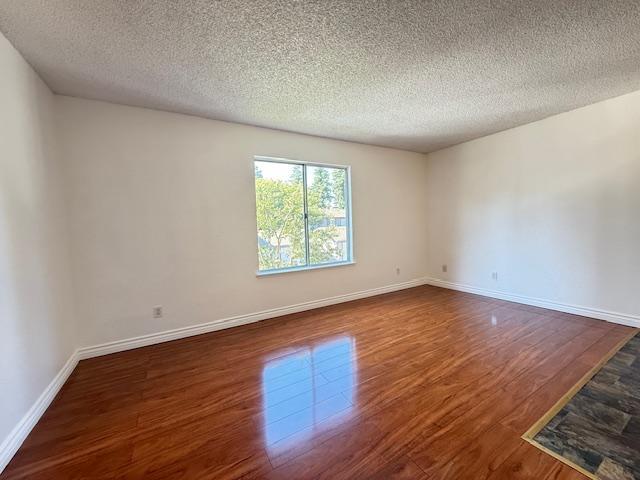 5145 East Lane Avenue, Unit 252 Fresno, CA 93727 - Photo 15 of 22 an empty room with wooden floor and windows