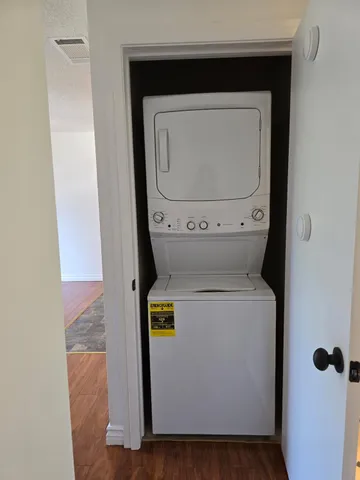 a view of balcony with wooden floor and fence