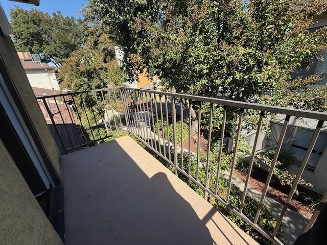 5145 East Lane Avenue, Unit 252 Fresno, CA 93727 - Photo 17 of 22 a view of balcony with wooden floor and fence