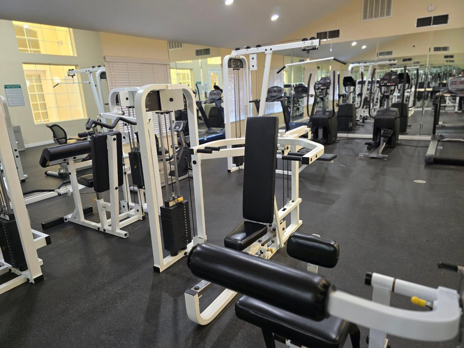 5145 East Lane Avenue, Unit 252 Fresno, CA 93727 - Photo 18 of 22 a room with gym equipment and view of living room