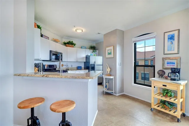a view of a kitchen with furniture and a fireplace