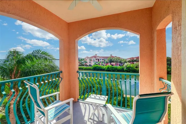 a view of a chair and table in the balcony