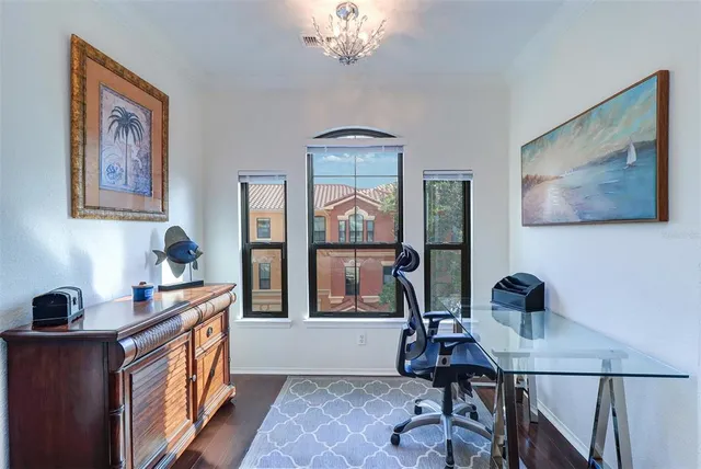 a bedroom with a bed and a table