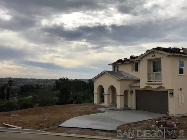 a view of a back yard of the house