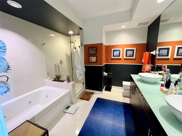 a very nice looking room with wooden floor and furniture