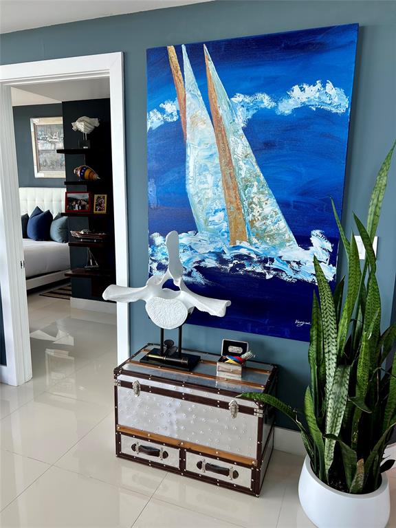 315 Northeast 3rd Avenue, Unit 2107 Fort Lauderdale, FL 33301 - Photo 5 of 19 a living room with furniture a rug and a chandelier