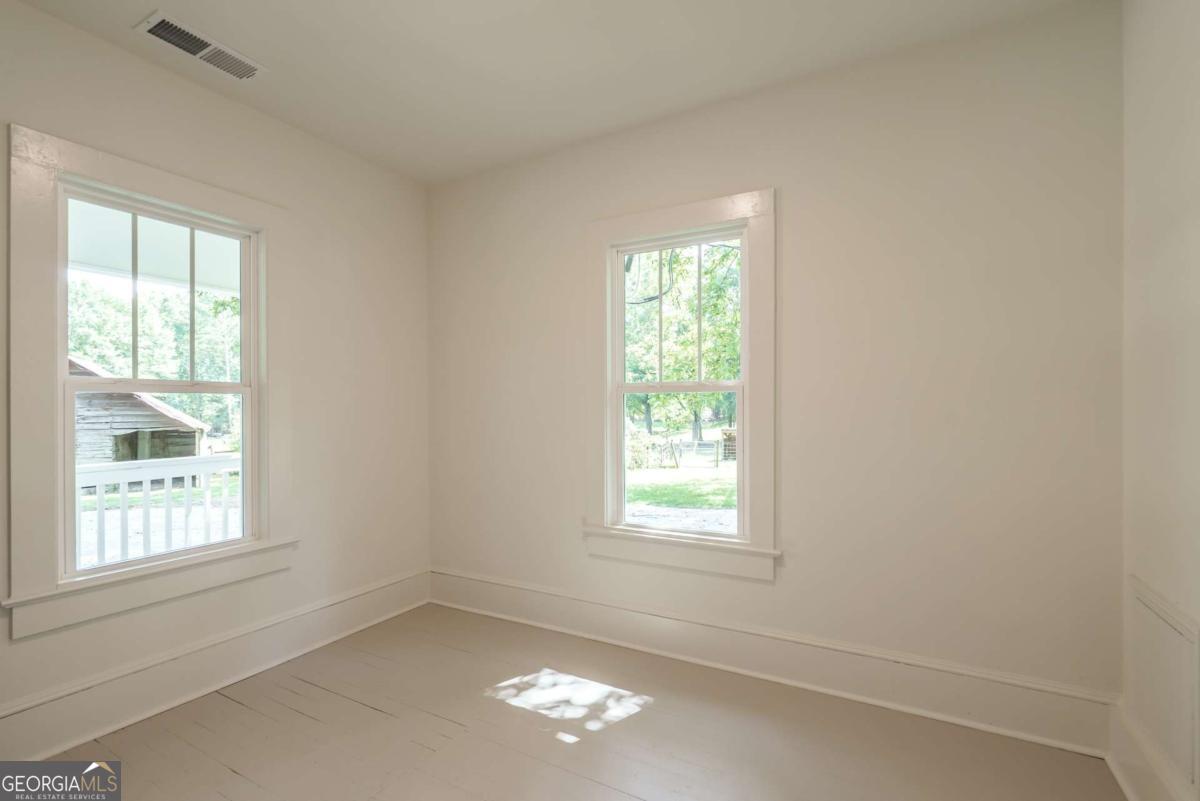 5380 Guthrie Road Loganville, GA 30052 - Photo 18 of 38 an empty room with a window